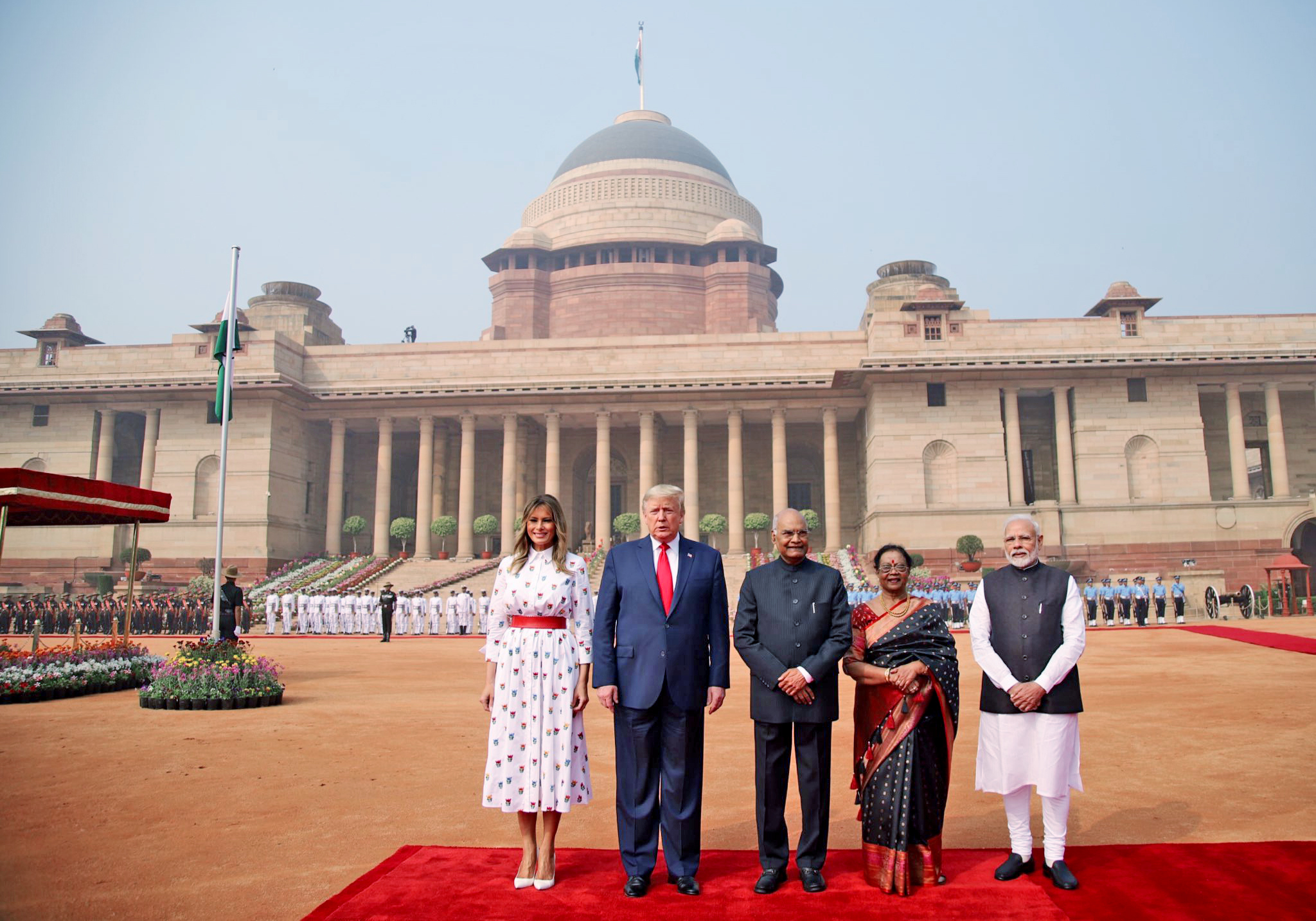 Modi-Trump pose for a group photo during a ceremonial reception at Rashtrapati Bhavan