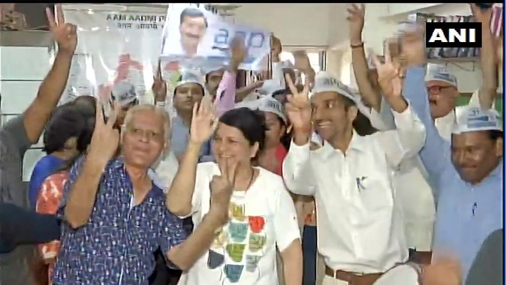 Aam Aadmi Party workers celebrate as trends indicate lead for the party