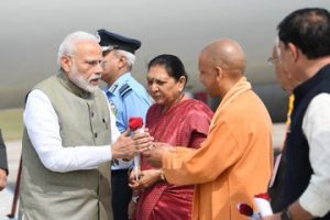 PM Modi being received on his arrival in Prayagraj, Uttar Pradesh
