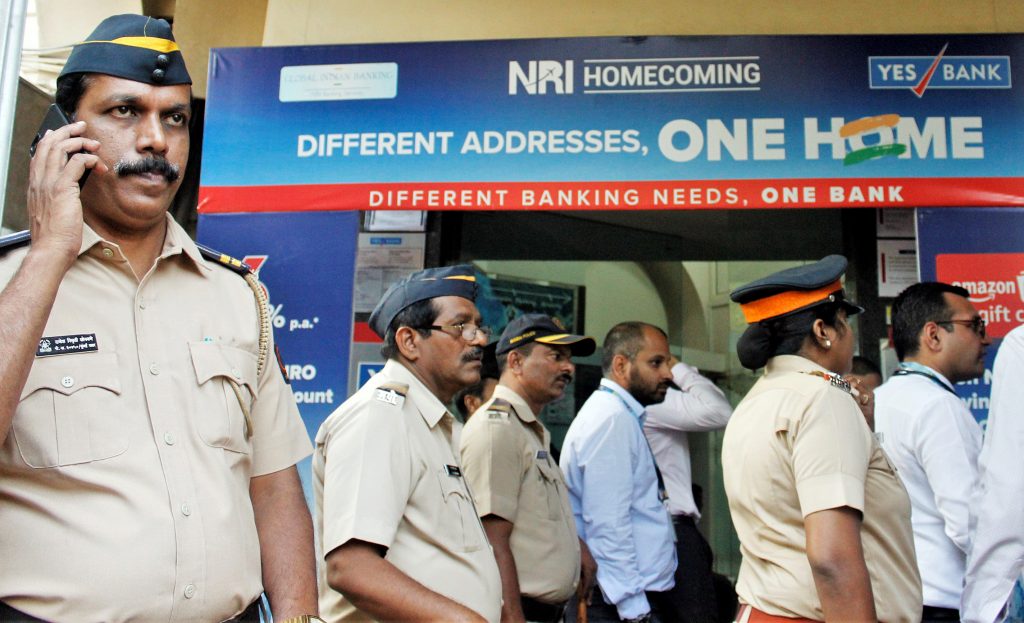 Yes Bank Crisis: Account holders stand in a queue to ...