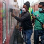 Railway workers clean coaches as a preventive measure against COVID-19 , coronavirus