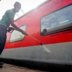 Railway workers clean coaches as a preventive measure against COVID-19 , coronavirus