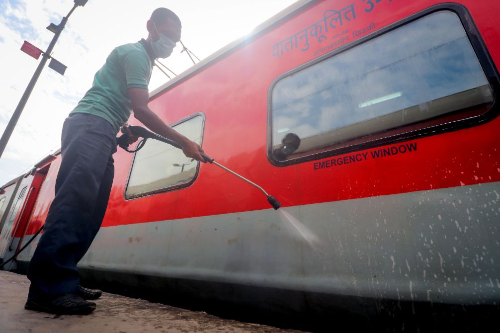 Railway workers clean coaches as a preventive measure against COVID-19 , coronavirus