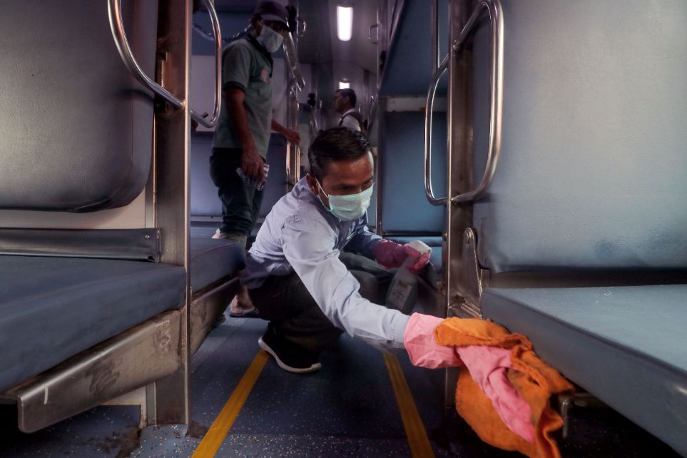 Railway workers clean coaches as a preventive measure against COVID-19 , coronavirus