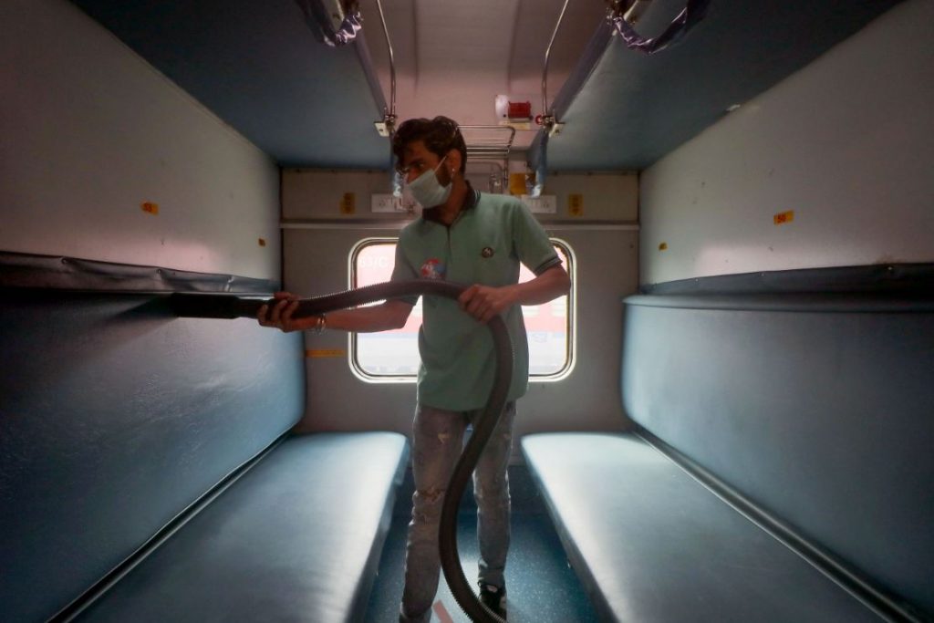 Railway workers clean coaches as a preventive measure against COVID-19 , coronavirus