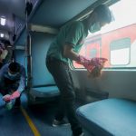 Railway workers clean coaches as a preventive measure against COVID-19 , coronavirus