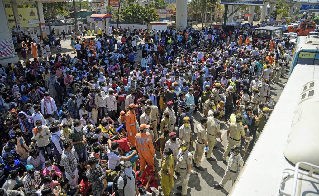 Amid lockdown, a sea of migrants in Delhi try to find their way back home