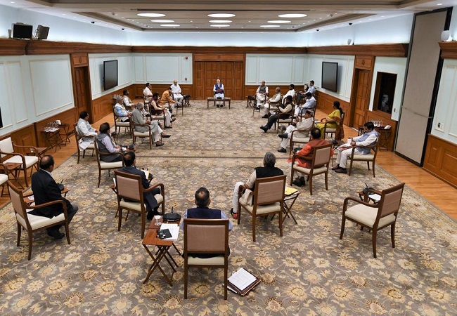 Leading by example: PM Modi & ministers practice ‘social distancing’ during cabinet meet