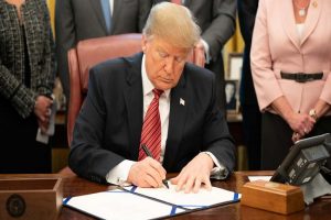Trump signs $8.3bn emergency funding package to fight COVID-19