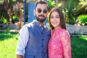 Anushka Sharma shares lovely picture cradling her baby bump, Virat’s comment is a absolute Winner