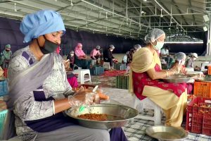 Volunteers of Radha Soami Satsang prepare food to distribute among the needy | See Pics