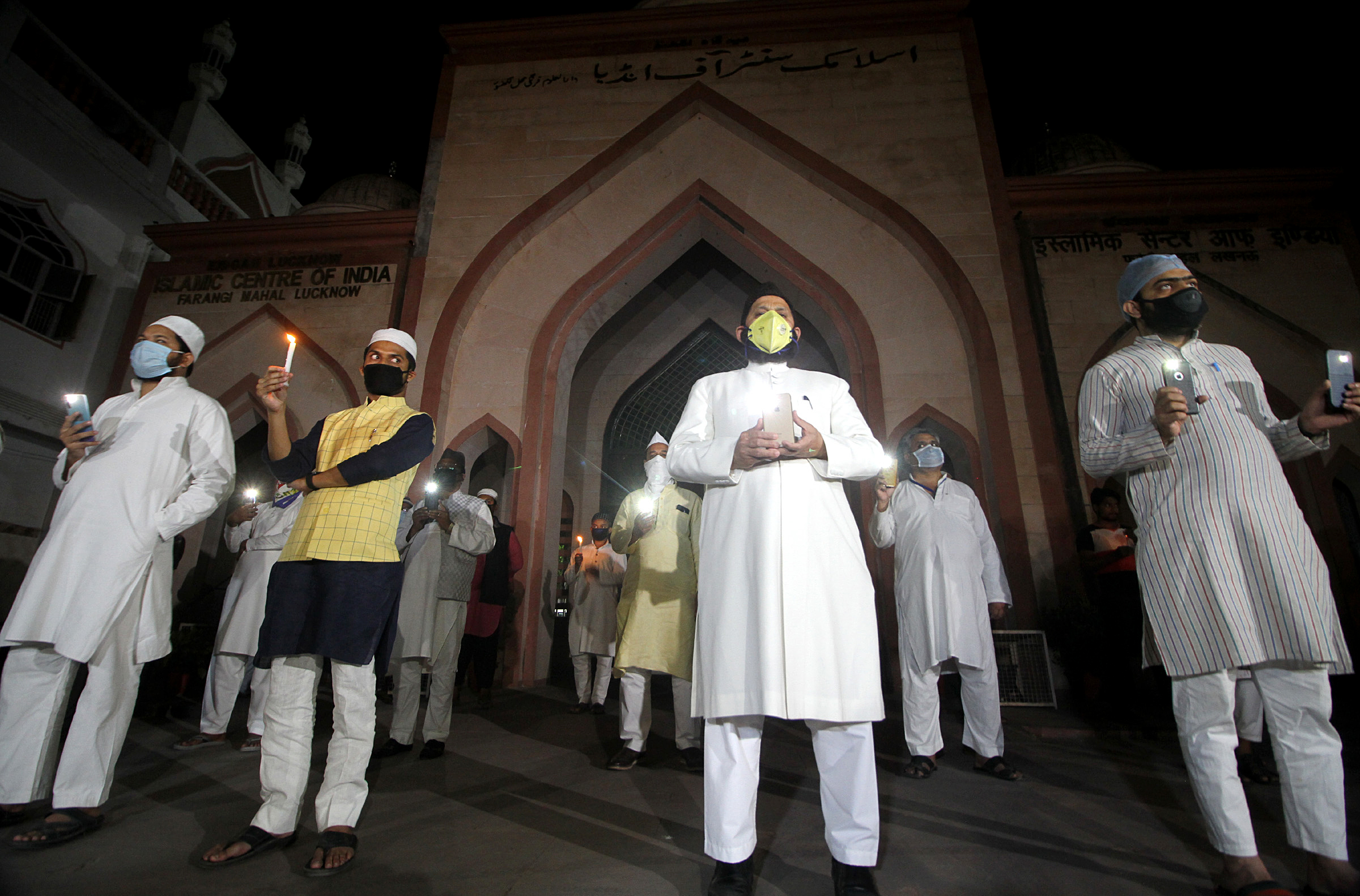 Muslim cleric along with his supporters light candles | See Pics