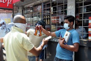 Lockdown 3.0 begins with long queues outside liquor shops