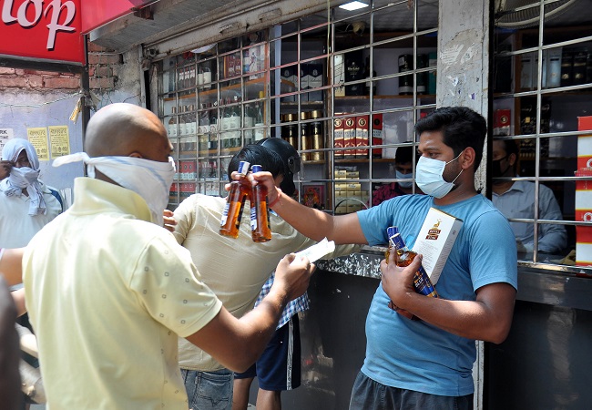 Lockdown 3.0 begins with long queues outside liquor shops