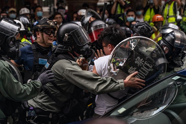 Hong Kong erupts in protest as China seeks to tighten grip on it via new legislation