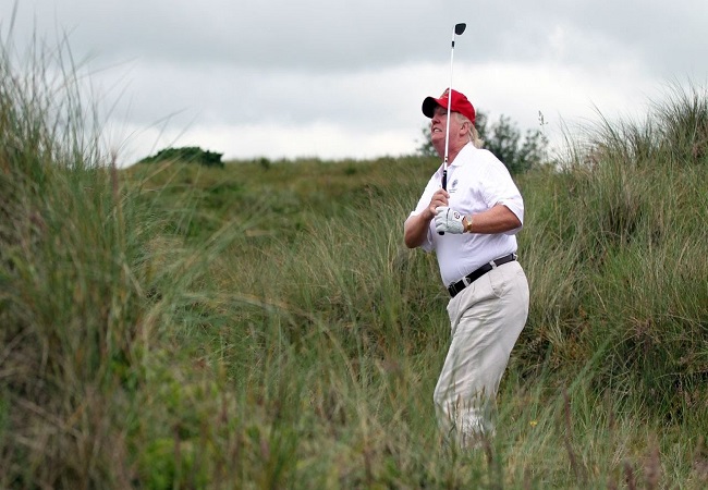 Trump seen golfing at his Virginia club as US death count nears 1 lakh