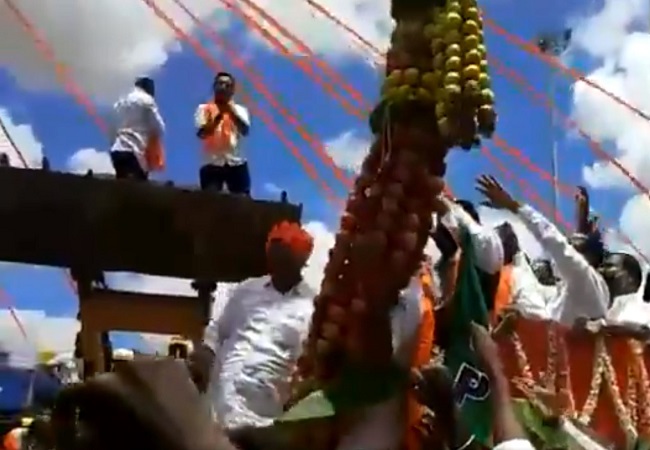 Karnataka minister attends procession, violates social distancing norms