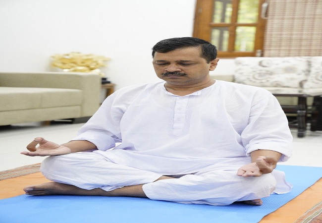 Delhi CM Arvind Kejriwal performs yoga on the 6th International Yoga Day