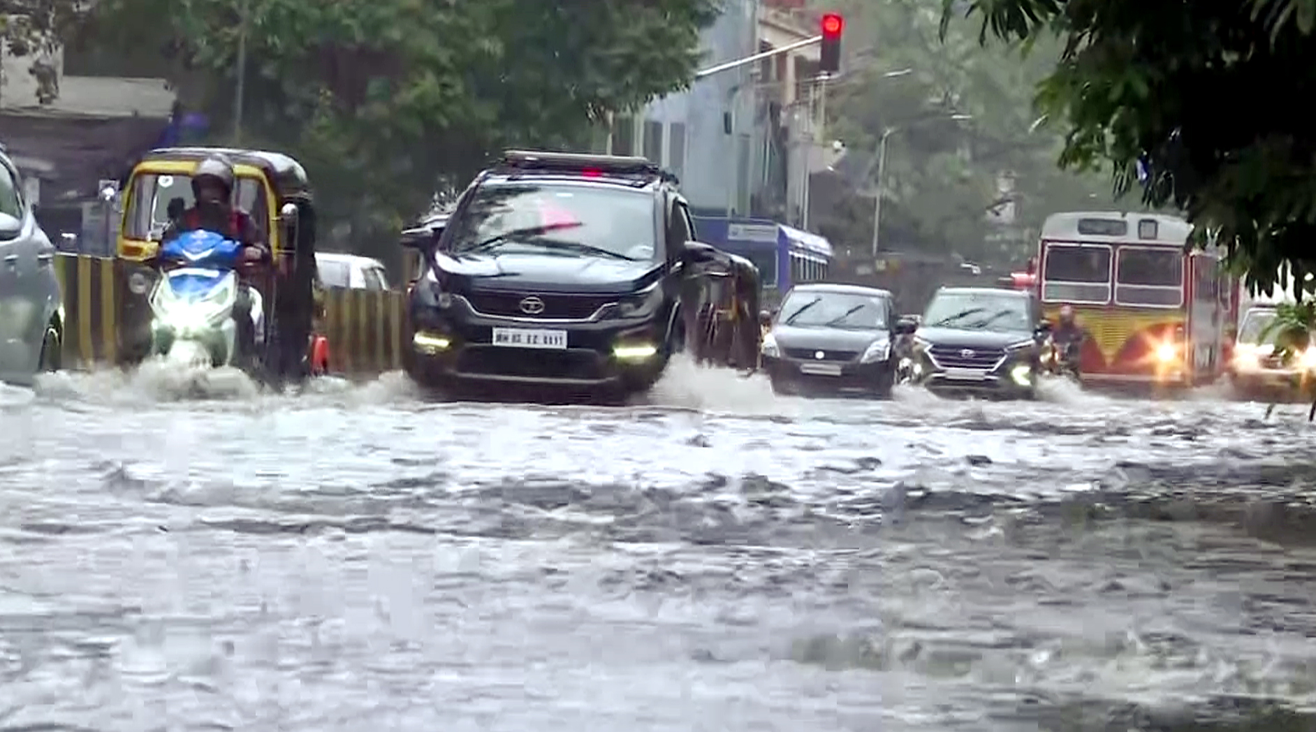 Maharashtra: Vehicles wade through water lodge street following heavy rainfall | See Pics