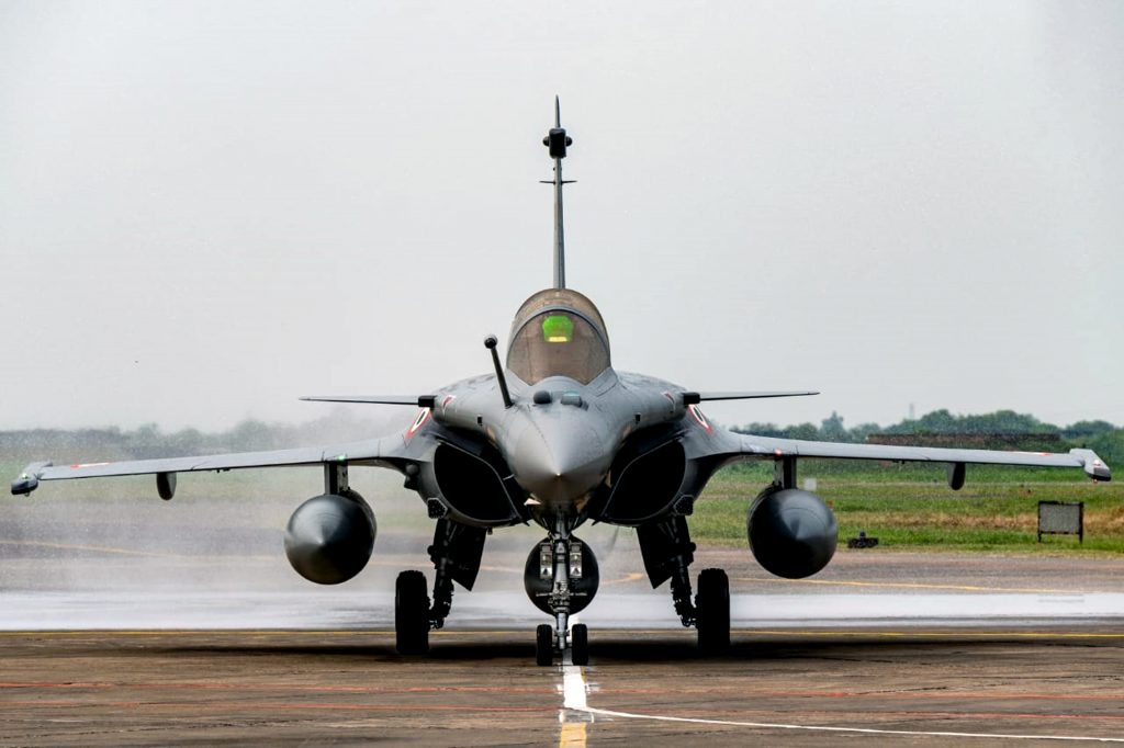 Rafale aircraft being presented a water cannon salute to mark its induction in Indian Air Force
