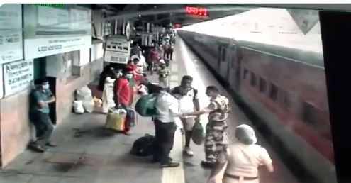 Security personnel help man who fell between platform, track (VIDEO)