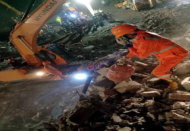 Search and rescue operation underway at the spot where a building collapsed in Kajalpura area of Raigad district on Monday. One dead and seven injured, several others still feared trapped under the debris.