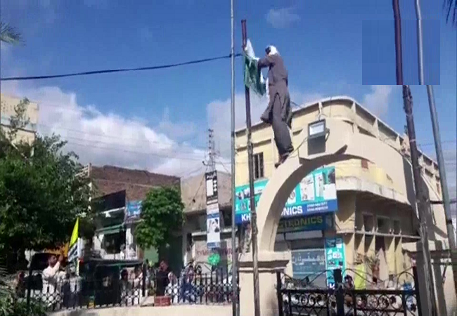 Activist pulls down pak flag in POK