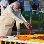 Prime Minister Narendra Modi pays tribute to Mahatma Gandhi on his birth anniversary at Raj Ghat, in New Delhi on Friday.