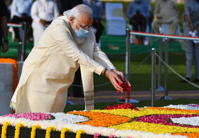Prime Minister Narendra Modi pays tribute to Mahatma Gandhi on his birth anniversary at Raj Ghat, in New Delhi on Friday.