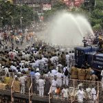 Police use lathi-charge and water cannon to disperse BJP workers during the party's state-wide 'Nabanna Chalo' agitation against the alleged killings of its workers in a state, in Kolkata on Thursday.