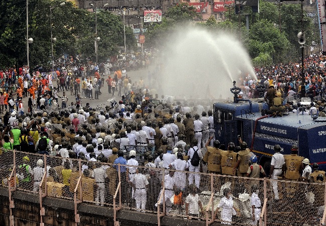 Police use lathi-charge and water cannon to disperse BJP workers during the party's state-wide 'Nabanna Chalo' agitation against the alleged killings of its workers in a state, in Kolkata on Thursday.