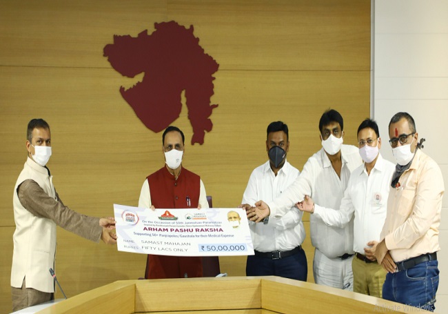 CM Rupani hands over Rs 1 lakh cheque each to 50 small panjrapols for medical veterinary