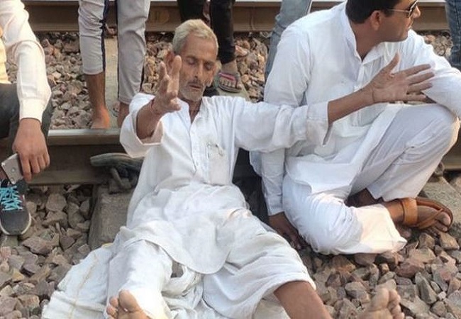 Members of the gurjar community block railway tracks