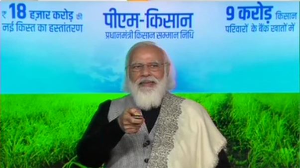PM Modi interacts with farmers after the release of Rs 18,000 crores as part of PM Kisan Samman Nidhi scheme