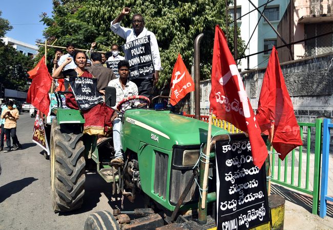 Telangana, Dec 08 (ANI): Left parties' supporters drive a tractor in support of the nationwide strike called by Farmers' Unions in Hyderabad on Tuesday. (ANI Photo)