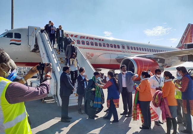 Telangana: A delegation of 80 foreign delegates are welcomed on their arrival at Rajiv Gandhi International Airport (Shamshabad Airport) on a special flight from Delhi, in Hyderabad on Wednesday. (ANI Photo)