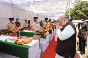 Amit Shah lay wreath at the coffins of 14 security personnel who lost their lives in the Naxal attack, in Jagdalpur