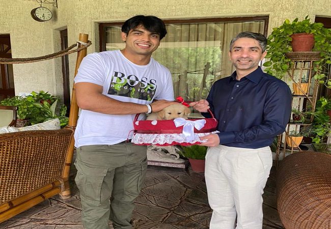 Abhinav Bindra presents Neeraj Chopra with a puppy named 'Tokyo'