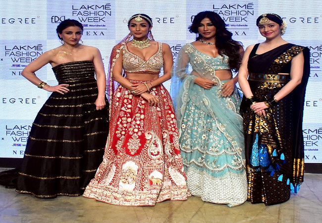 Bollywood actresses Malaika Arora, Chitrangda Singh, Soha Ali Khan, and Divya Khosla Kumar during the 'FDCI x Lakme Fashion Week' fashion show
