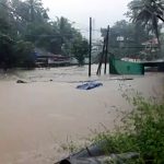 Flood water gushes through low-lying areas triggered by heavy incessant rains