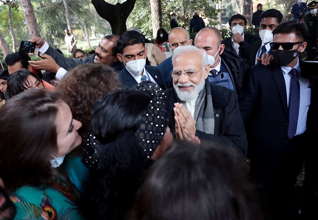 Prime Minister Narendra Modi interacts with the members of the Indian community gathered at Piazza Gandhi,