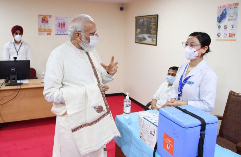 PM Modi interacts with health workers at the vaccination site at RML Hospital