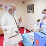 PM Modi interacts with health workers at the vaccination site at RML Hospital