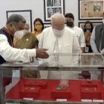 PM Modi walk through the exhibition of paintings of Ajanta frescos, Buddhist Sutra Calligraphy and Buddhist artefacts excavated from Vadnagar and other sites in Gujarat.