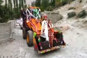 Viral Video: Pakistani Couple takes an excavator-ride to arrive in village, Netizens are amused