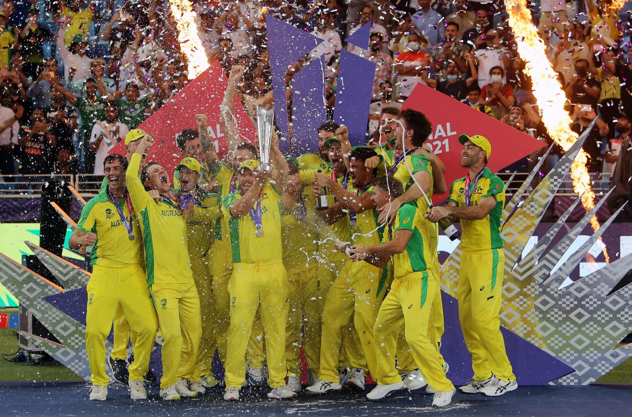 Australian players celebrate with the trophy after winning the ICC mens Twenty20 World Cup final match against New Zealand,