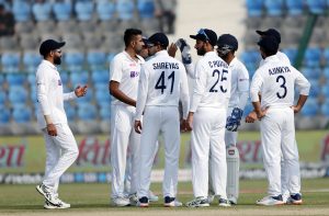 Ravichandran Ashwin of India celebrates the wicket of William Young of New Zealand