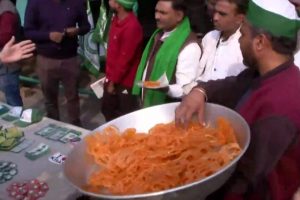 People celebrate at Ghazipur border with ‘Jalebis’ following PM Modi’s announcement to repeal all three farm laws.