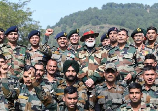 PM Modi with members of Armed forces on his Diwali visit at Nowshera, Rajouri border post, Line of Control