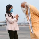 A young girl greets PM Modi during his visit to West